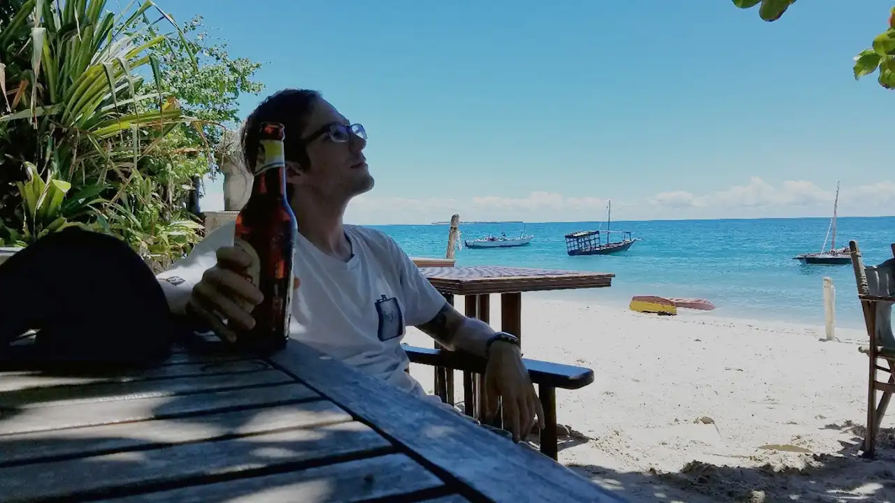 Digital nomad working on beach in Zanzibar