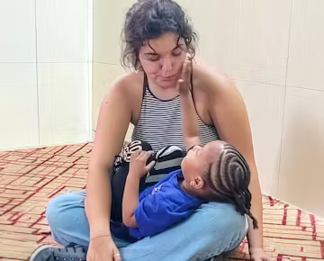 Medical practitioner with local team in clinic